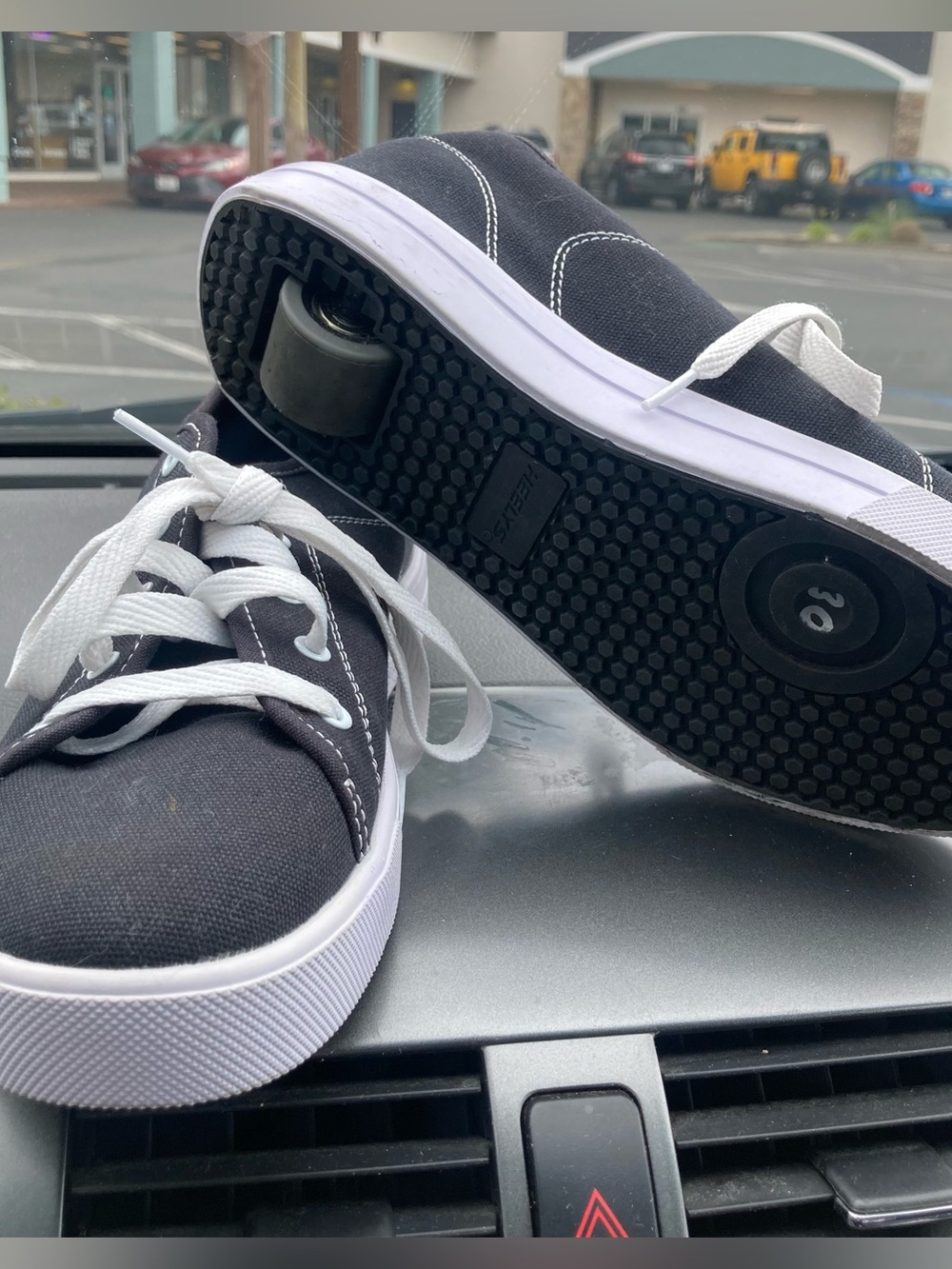 Black Canvas Heelys with White Laces and Wheel
